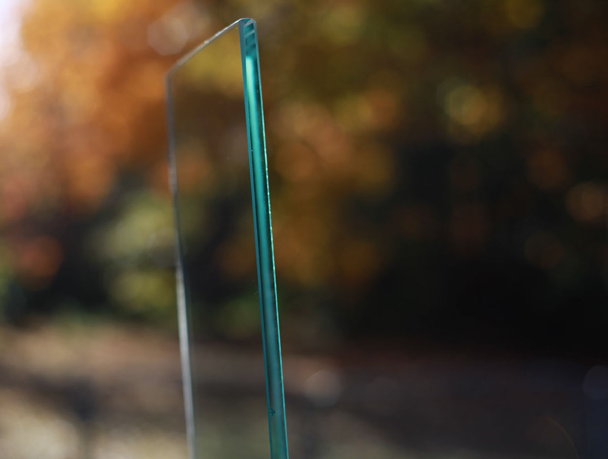 A photograph of a cut piece of glass outside